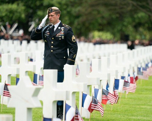 American Soldier Saluting Troops at Cemetery